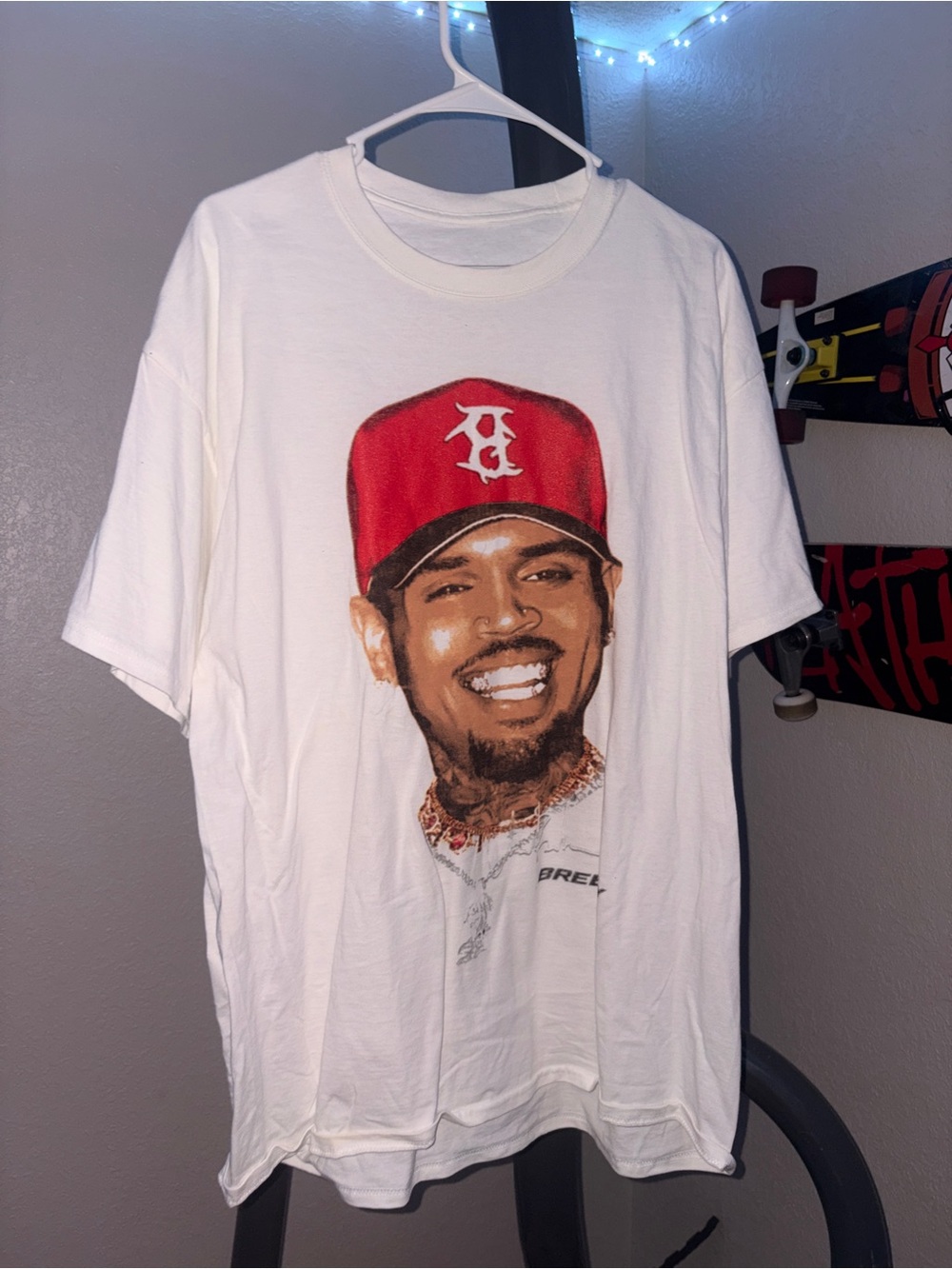 Chris brown White Graphic Tee with Red Hat Portrait